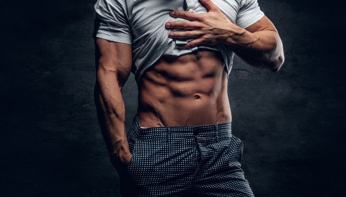 fit man showing 6 pack abs