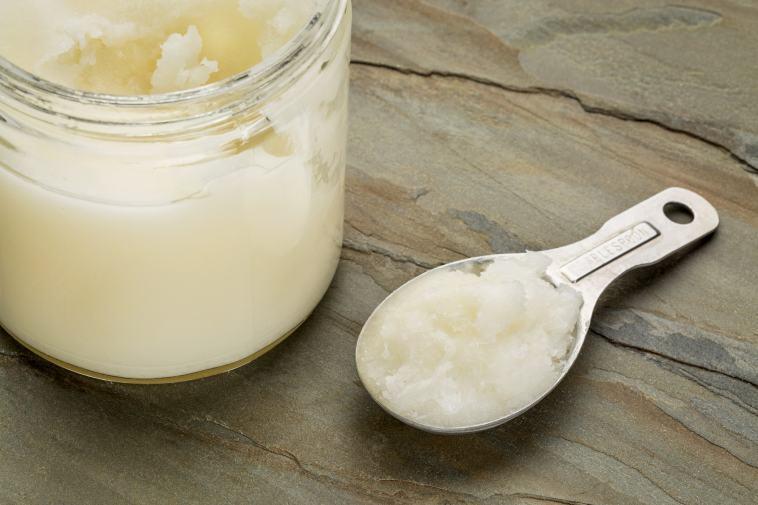 jar and spoon of coconut oils